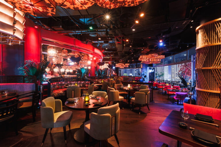 Dining room with red feature canopy and lantern clusters at Asia Asia Pier 7, Dubai Marina